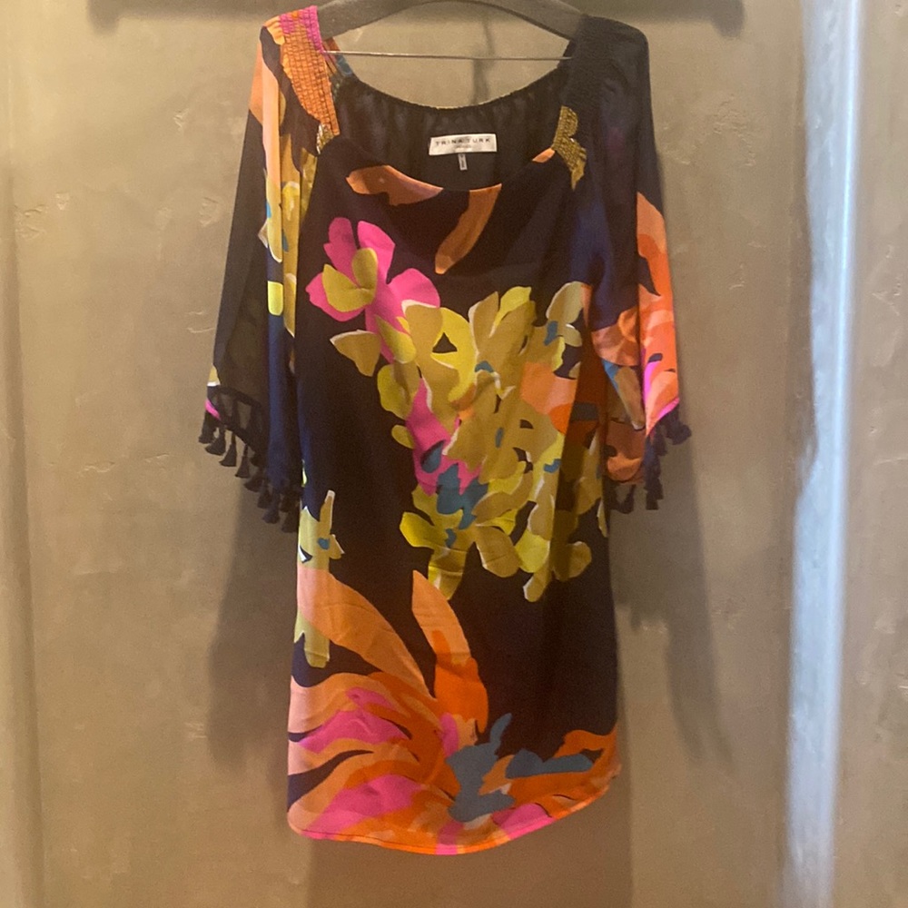 Trina Turk Sheath dress. Multi colored flower print on black background.